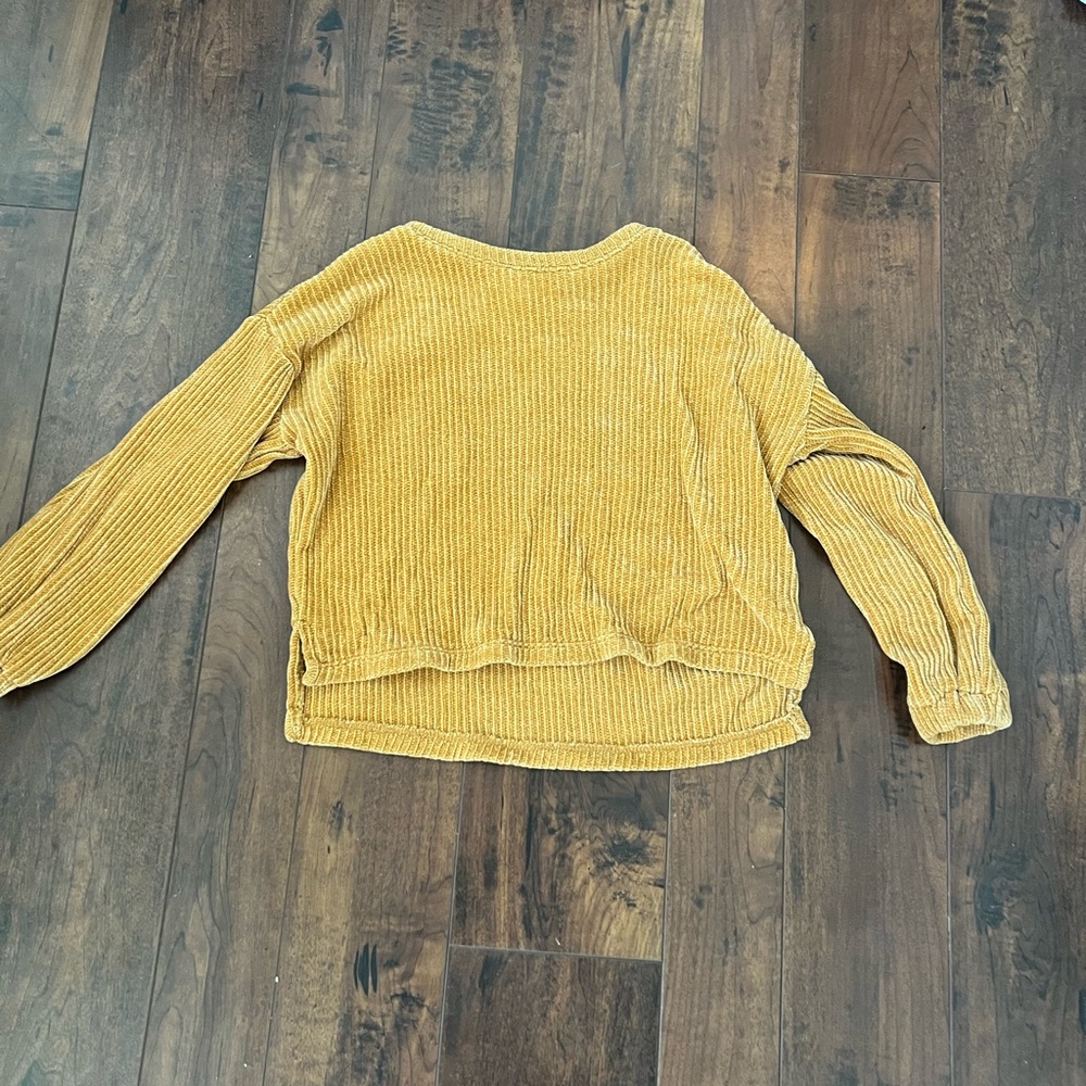 Various youth sweaters of various colors.